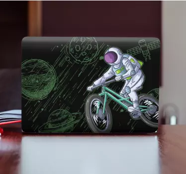 Nálepka na notebook astronaut hrajúci bicykel na oblohe - Tenstickers